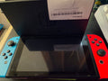 CONSOLES NINTENDO SWITCH AVEC JOYCON BLEU ET ROUGE ET DOCK SANS BOÎTE